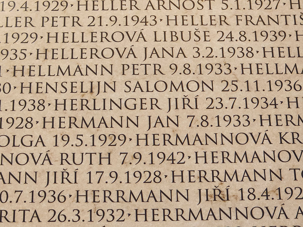 At a museum in Terezín, Czech Republic, a wall bearing names of child victims who were deported from the ghetto to death camps includes the name Jiří Herlinger. (NCR photo/Chris Herlinger)